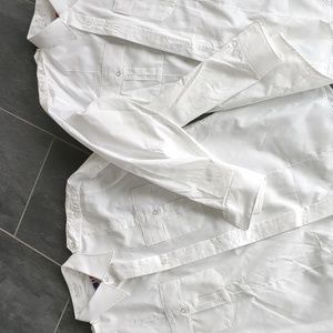 2 white uniform shirts. Flying cross